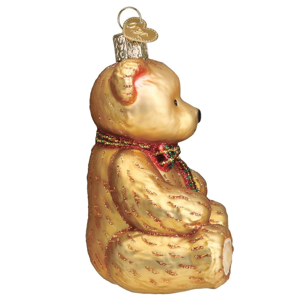 Old World Christmas Teddy Bear ornament red bowtie adds character to Christmas tree memories.