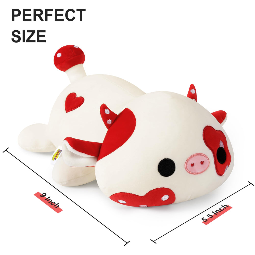 Onsoyours cow plush on sofa as cozy decor.