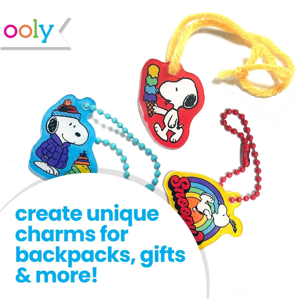 Ooly Snoopy designs image showcasing surfing and biking charms for playful accessories.