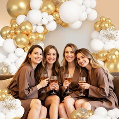 Ouddy Party 12in gold balloon creates shimmering focal points.
