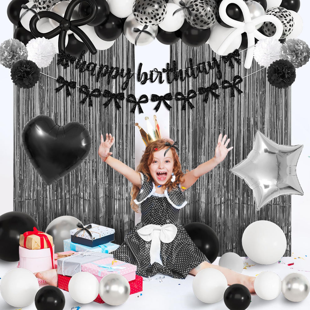 Ouddy Party black bow decorations decorate tables and walls with sleek charm.