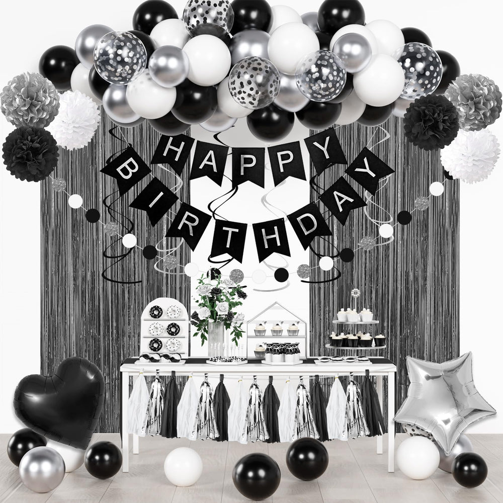 Ouddy Party black and white confetti balloons create a chic birthday focal point.