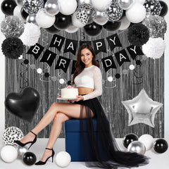 Ouddy Party circle dots garland ties the décor together with stylish black contrast.