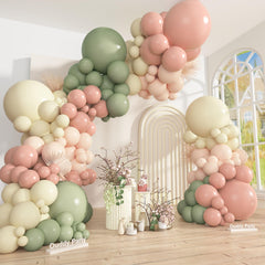 Ouddy Party dusty pink and green arch setup creating a chic backdrop