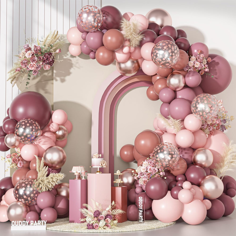 Ouddy Party dusty rose 18in arch balloons create a romantic backdrop for photos.