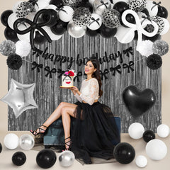 Ouddy Party tissue tassels in black and white add texture and movement.