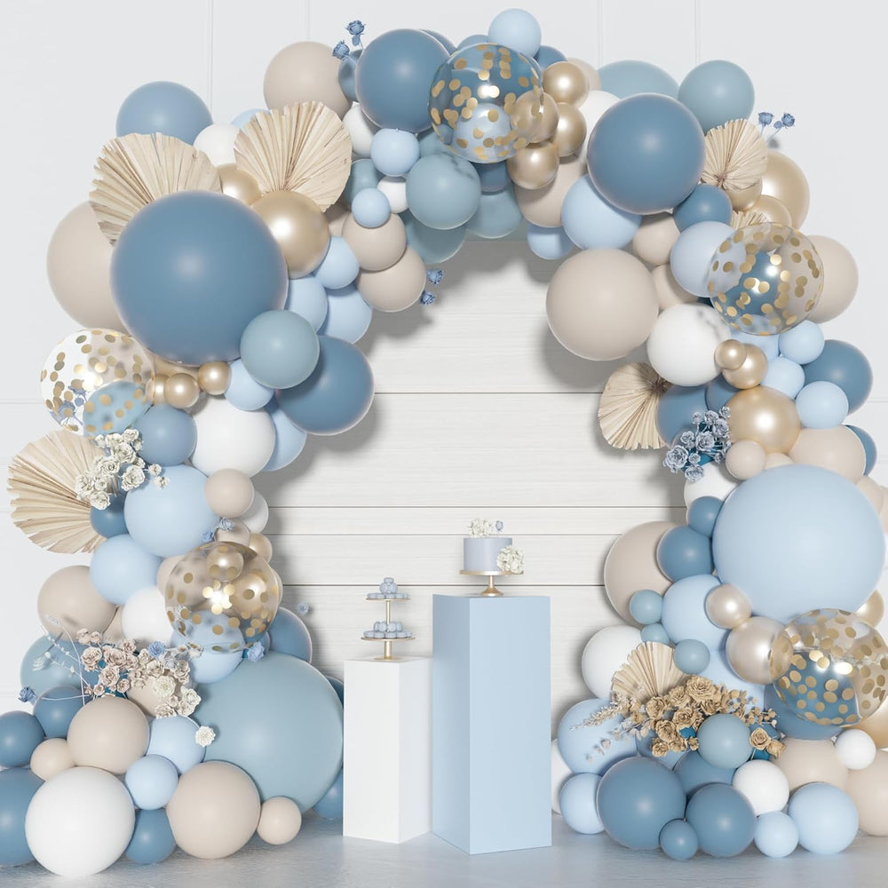 Ouddy Party wedding decor using a dusty blue arch for photo moments