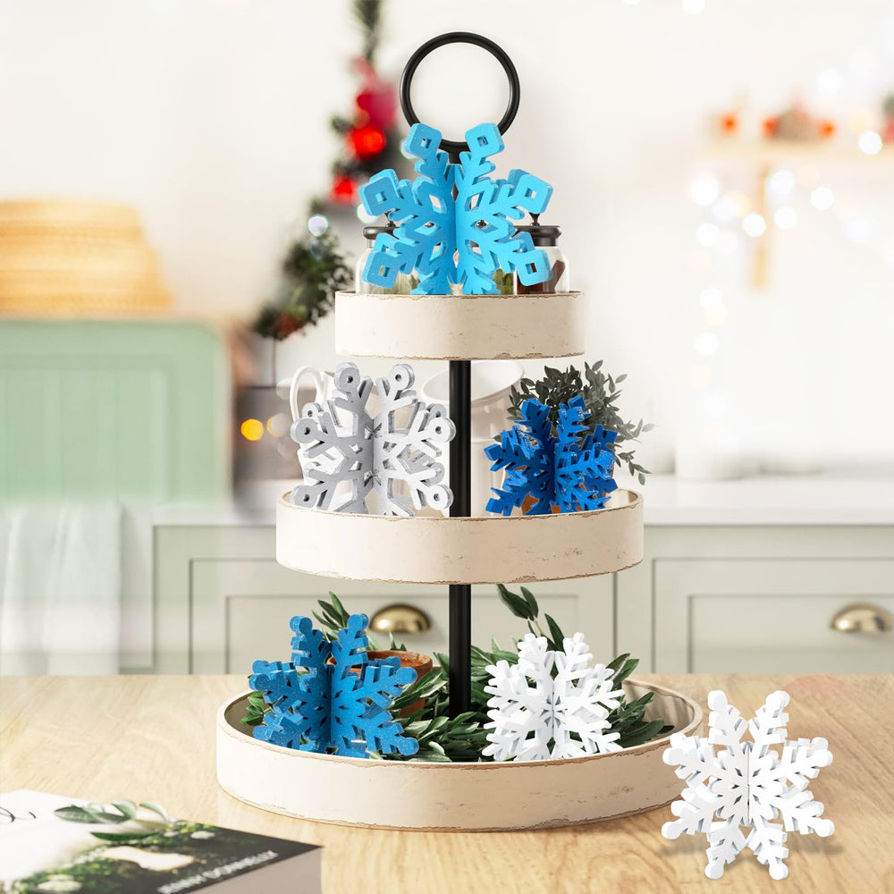 OuMuaMua glitter snowflake detail highlights blue-white shimmer on holiday tables.
