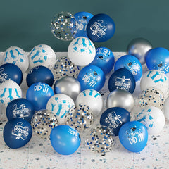 OuMuaMua class of 2026 balloon arch in blue, white, and silver for standout photos.