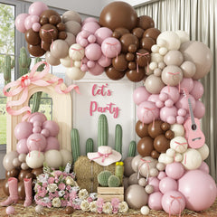 Paayeq pink brown cowgirl balloon arch kit creates a chic boho backdrop.