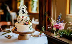 Palegg mr-and-mrs-topper adds elegant focal point to the cake.
