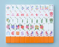Paradise Mahjong Tiles front design with a vibrant orange back for stylish game nights.