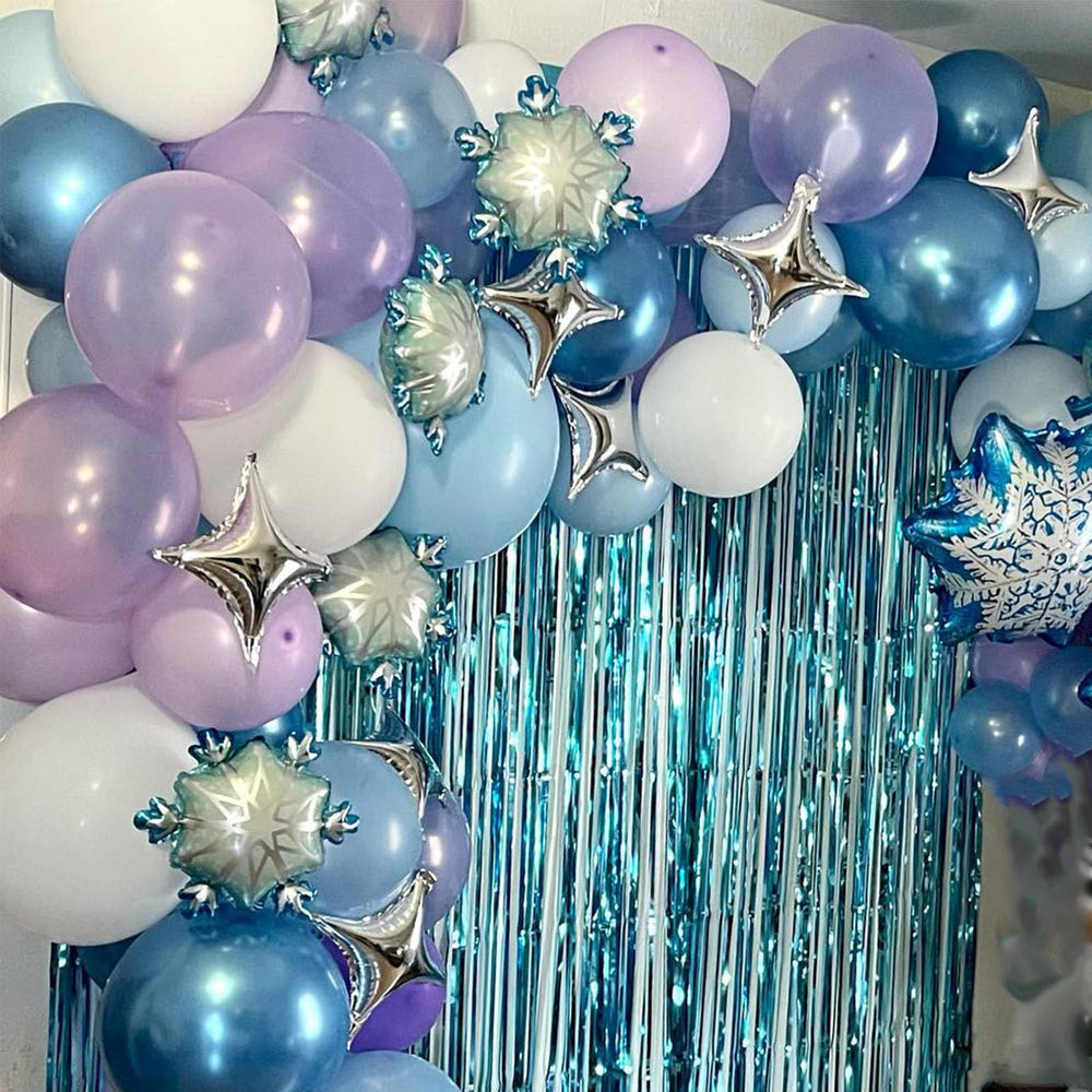 Paready pastel blue balloons soften the room with a frosty feel.