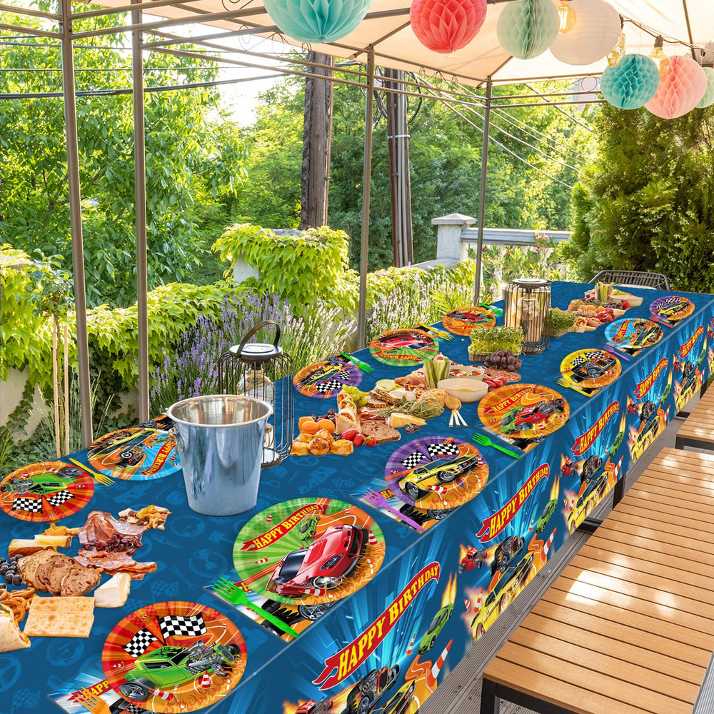 Party Greeting racing tablecloths with a central racetrack enhance the theme.