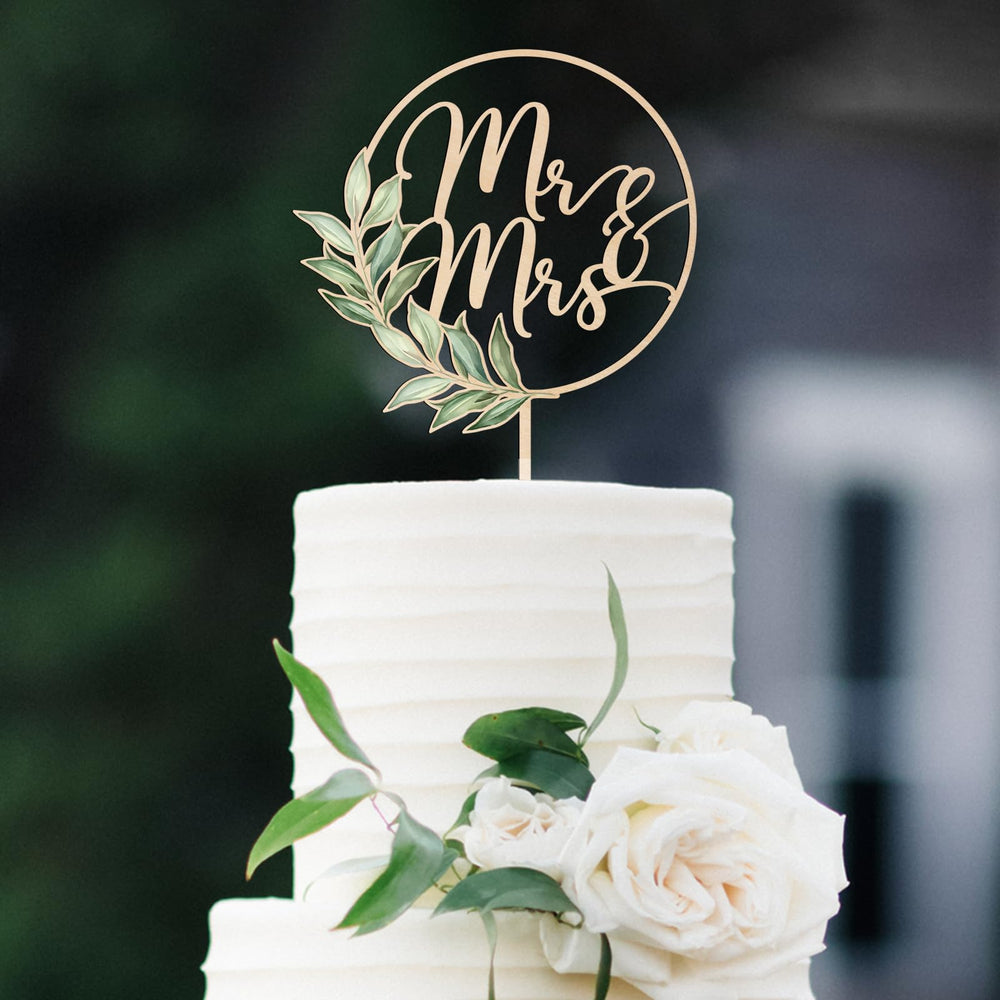 Party to Be Mr & Mrs Greeny cake topper close-up showing natural wood texture for rustic wedding.