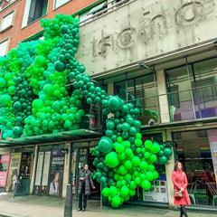 PartyWoo green 10-inch balloons balance displays for gatherings.