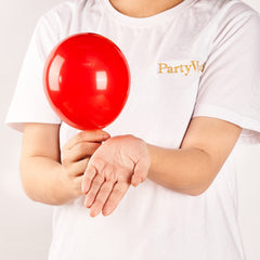 Close-up of PartyWoo matte red latex balloons showing durable finish