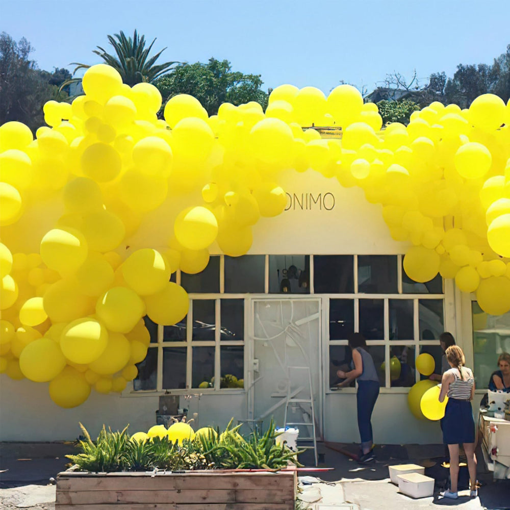 PartyWoo helium-filled yellow balloons provide floating accents