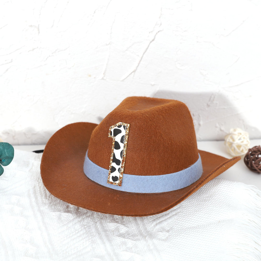 PATRDIO Cowboy 1st Birthday Hat blue flat lay showing color and shape.