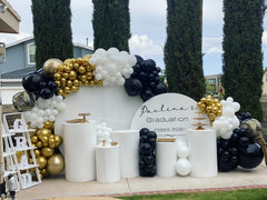 PATYDECRO party backdrop setup featuring black, white and gold tones.
