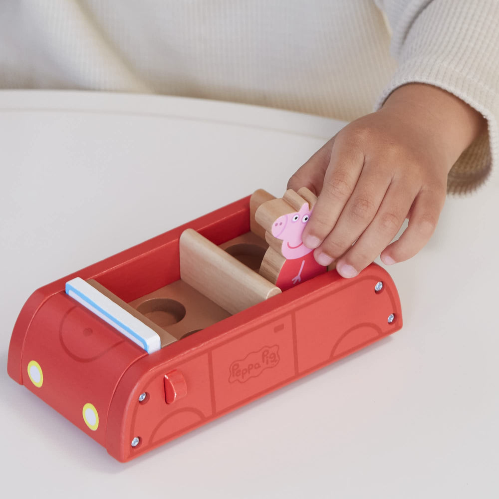 Peppa Pig figures George and Peppa sit inside the car