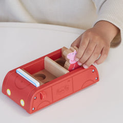 Peppa Pig figures George and Peppa sit inside the car
