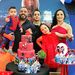 Party table setup with Piegricdiat Spidey toppers and wrappers for themed events
