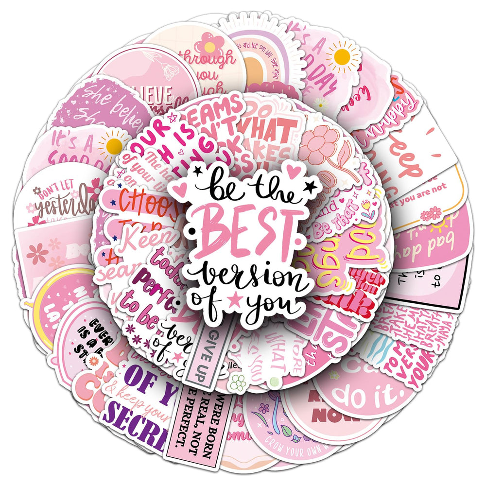 Pink motivational stickers on a laptop with positive quotes