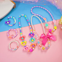 Young girl wearing colorful PinkSheep necklace and bracelet for daily outfits.
