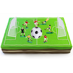 Pistha soccer coach figure topper completes a game-day dessert scene.