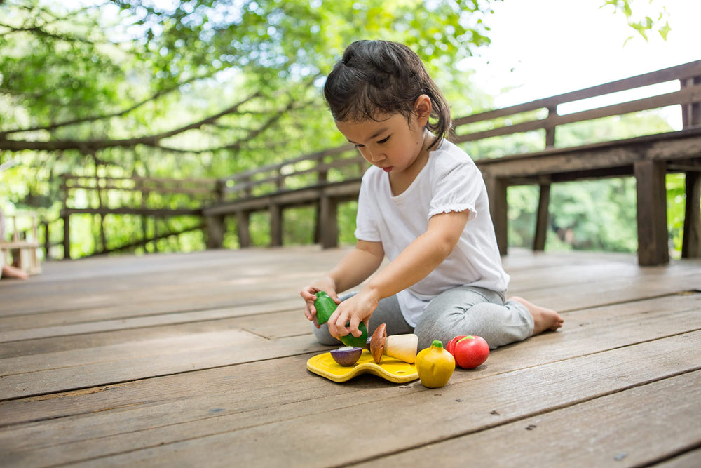PlanToys wooden vegetables close-up, showcasing durable, eco-friendly materials for pretend play.