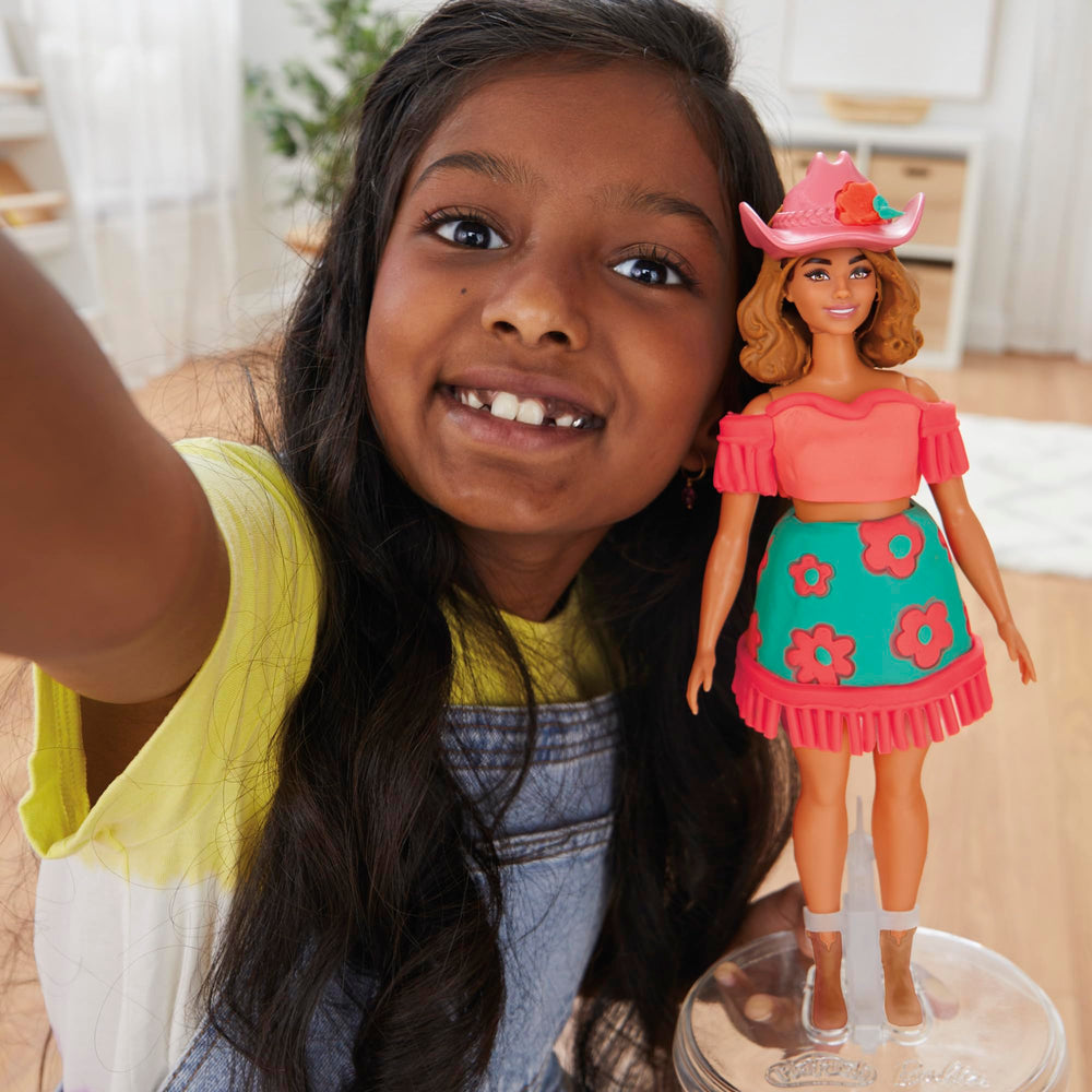 Boots accessory adds final touches to Barbie's country-style ensemble.