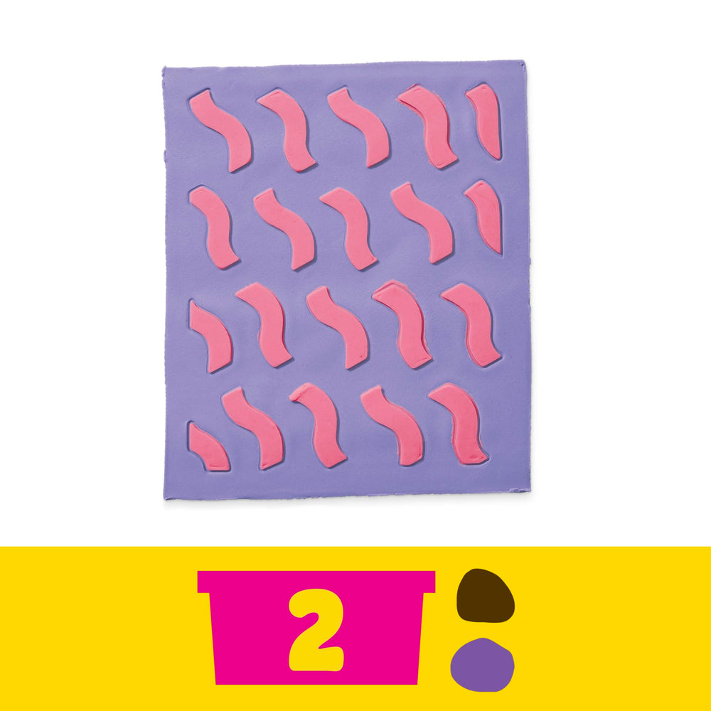 Two Play-Doh color cans expand design options with brown and purple tones.