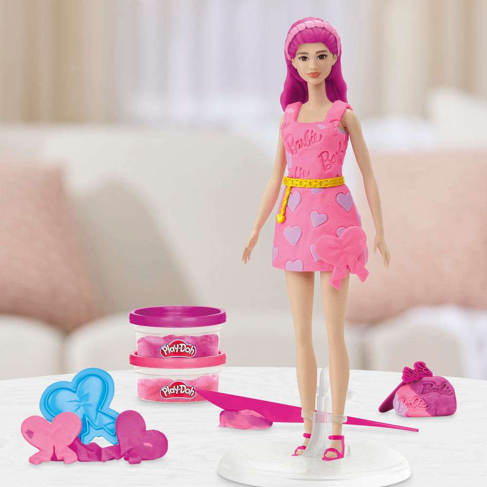 Two-ounce pink and purple Play-Doh cans expand color options for outfits.