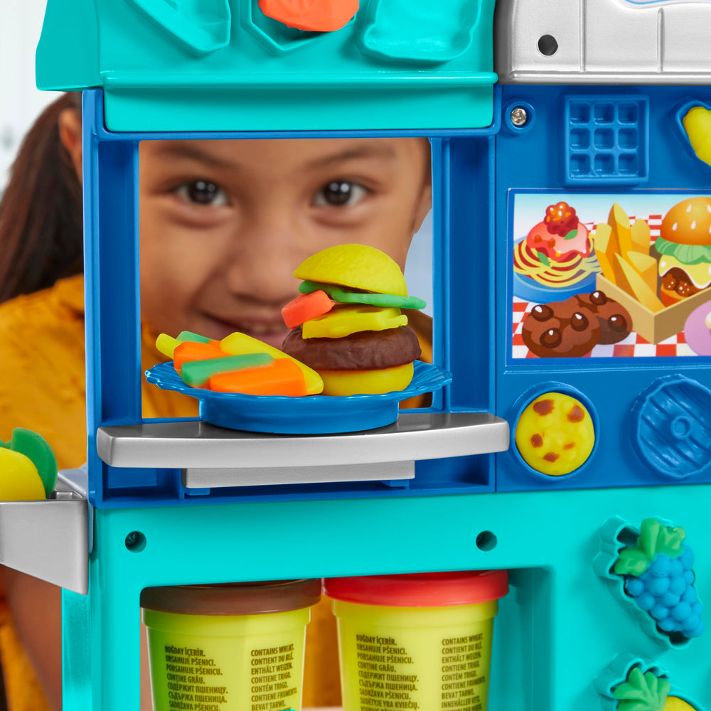 Play-Doh Kitchen Creations Busy Chef's Restaurant playset prep station and griddle in motion