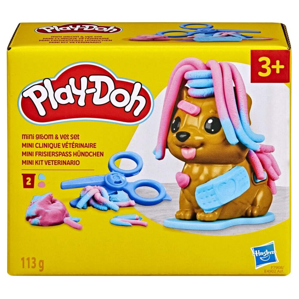 Play-Doh Mini Groom 'n Vet Set puppy on grooming base for pretend grooming.
