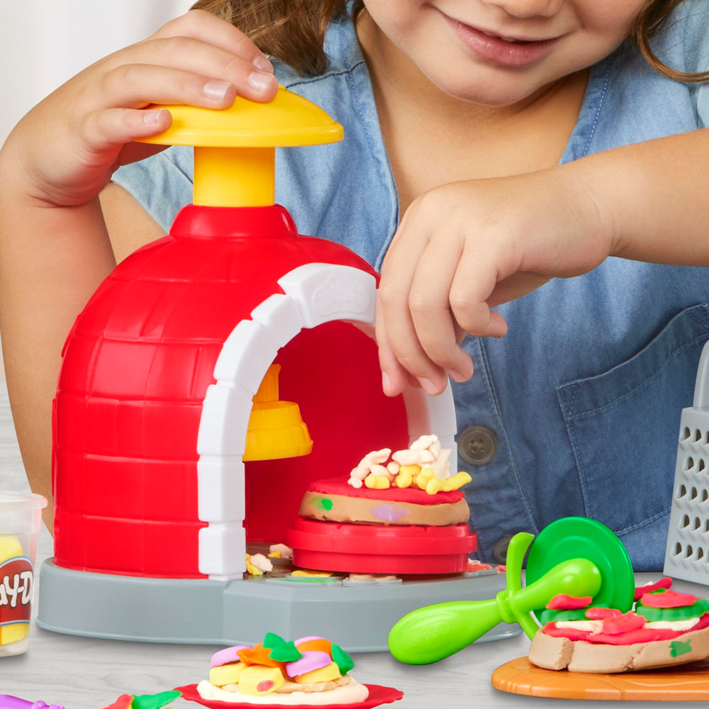 Play-Doh plates and utensils complete the pretend dining setup
