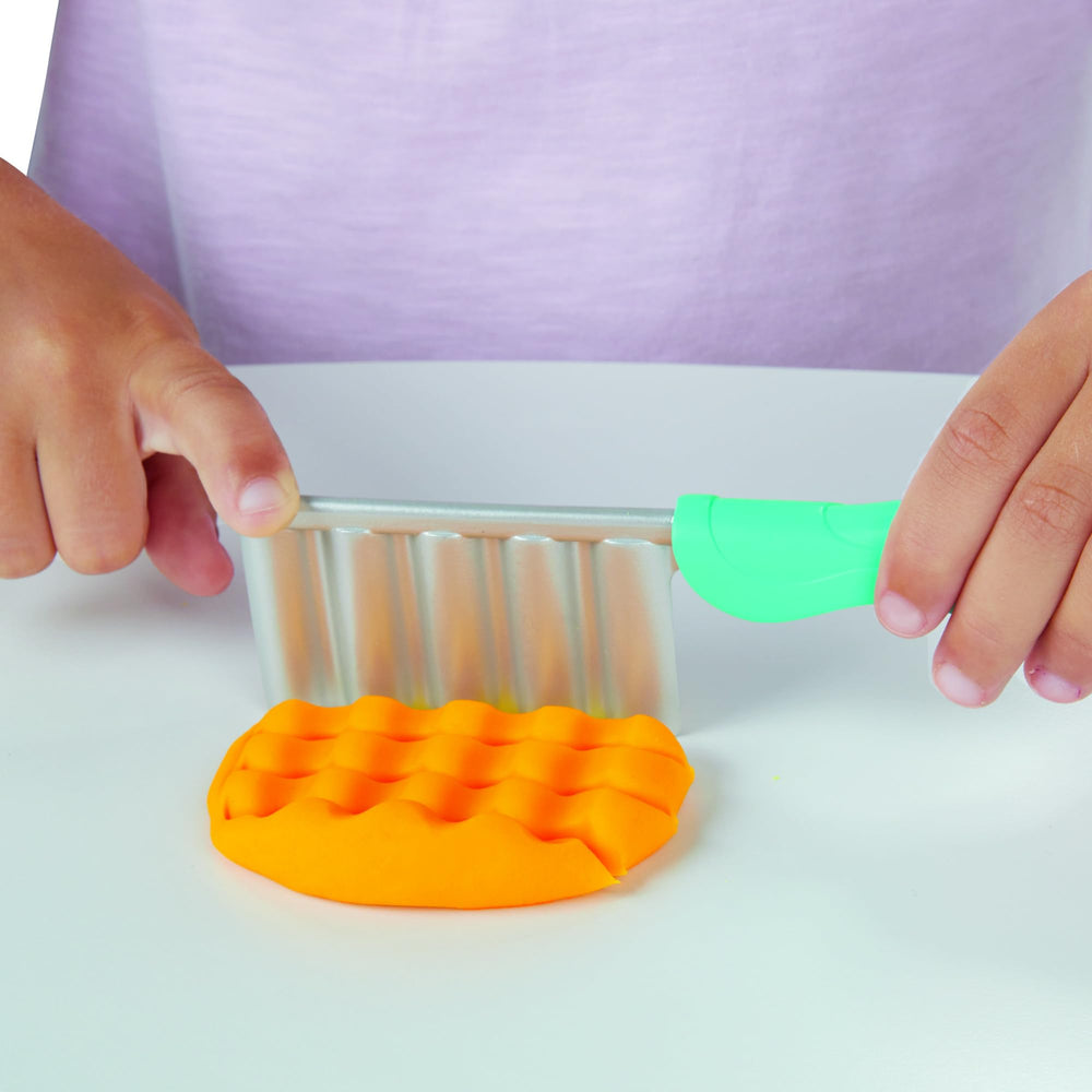 Play-Doh Spiral Fries crinkle-cut fries sliced with knife for silly kitchen creations