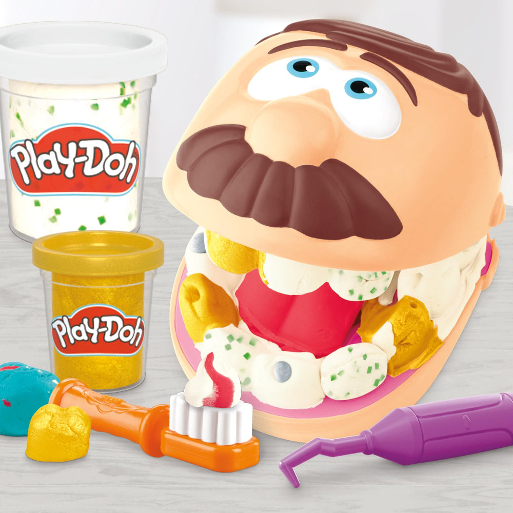 Play-Doh toothbrush tool encourages brushing practice within a playful dental routine.