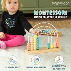 Neutral boho rainbow nursery decor with Play Platoon educational toy
