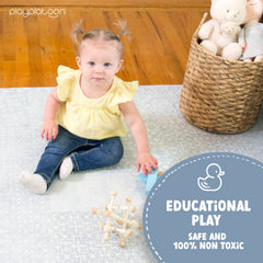 Baby doing tummy time on extra-thick foam tiles by Play Platoon