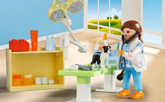 Playmobil exam table and lamp scene helps storytelling and learning.
