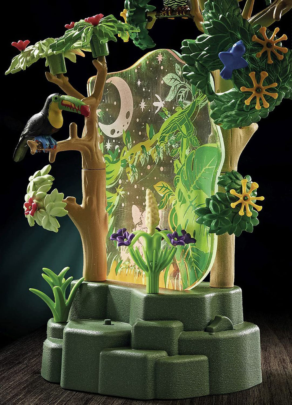 Playmobil Wiltopia acrylic plates illuminate two cozy rainforest scenes.