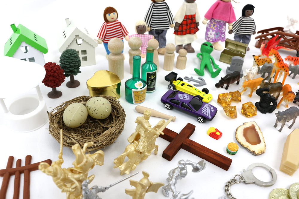 Mixed-material miniatures from PlayTherapySupply support tactile sensory exploration.