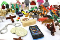 Symbolic items variety in PlayTherapySupply Sandtray enable client-led exploration of emotions.