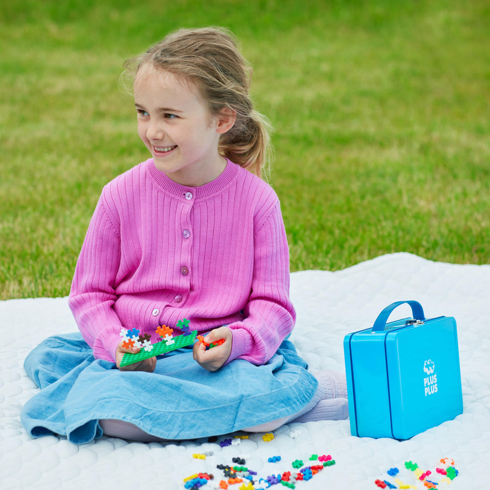 PLUS PLUS guide book helps beginners learn simple builds and ideas.