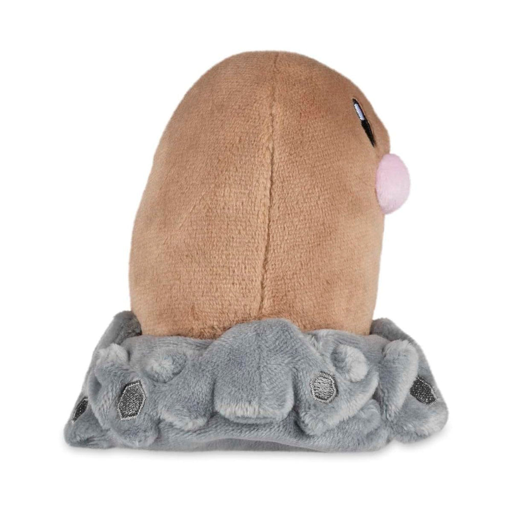 Pokemon Center Diglett Sitting Cuties Plush on a desk charming desk companion