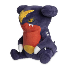 Pokémon Center Garchomp Dolls Plush on-desk setting demonstrates easy care with surface wash.