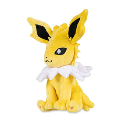 Pokémon Center Jolteon Sitting Cuties Plush sits upright on a desk, a playful desk companion.
