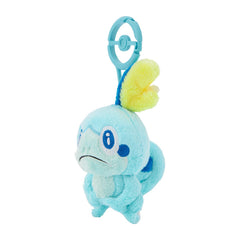 Sobble plush clipped to a backpack, portable Pokémon companion